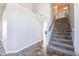 Inviting staircase with carpeted steps, wooden handrail, and natural light; leads to the upper level at 15039 S 28Th St, Phoenix, AZ 85048