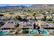 Gorgeous aerial view of desert homes with backyard pools, immaculate landscaping and beautiful mountain scenery at 1635 E Silverwood Dr, Phoenix, AZ 85048