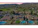 Community featuring luxurious homes with sparkling pools and green manicured lawns at 1635 E Silverwood Dr, Phoenix, AZ 85048