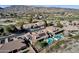 Aerial view of meticulously kept homes with backyard pools and mountain views in a golf course community at 1635 E Silverwood Dr, Phoenix, AZ 85048