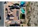 Aerial view of backyard highlighting private pool, solar panels and meticulously kept artificial turf at 1635 E Silverwood Dr, Phoenix, AZ 85048