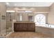 Bathroom featuring double vanity, walk-in shower and soaking tub at 1635 E Silverwood Dr, Phoenix, AZ 85048