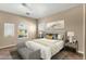 Cozy bedroom featuring neutral tones, a plush bed, and a bright window for natural light at 1635 E Silverwood Dr, Phoenix, AZ 85048