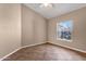 This bedroom has neutral walls, tiled floors and one window at 1635 E Silverwood Dr, Phoenix, AZ 85048
