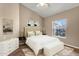 Serene bedroom with vaulted ceilings, a comfortable bed, and ample natural light from a large window at 1635 E Silverwood Dr, Phoenix, AZ 85048
