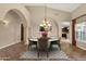 Formal dining room with chandelier, neutral colors, views of the kitchen, and open floor plan at 1635 E Silverwood Dr, Phoenix, AZ 85048