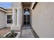 Inviting front entry featuring decorative columns, unique hanging lantern and security door at 1635 E Silverwood Dr, Phoenix, AZ 85048
