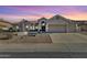 Charming single-story home with a landscaped front yard and a spacious two-car garage at 1635 E Silverwood Dr, Phoenix, AZ 85048