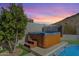 Relaxing backyard hot tub situated near lush greenery and a view of a serene landscape at 1635 E Silverwood Dr, Phoenix, AZ 85048