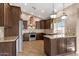 Updated kitchen with dark cabinets, stainless steel appliances, and stylish backsplash tiles at 1635 E Silverwood Dr, Phoenix, AZ 85048