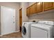 Laundry room features a washer, dryer and storage at 1635 E Silverwood Dr, Phoenix, AZ 85048