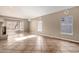 Bright living room with neutral walls, tiled floor, several windows and corner fireplace at 1635 E Silverwood Dr, Phoenix, AZ 85048