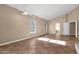 Bright living room featuring tiled flooring, recessed lighting, and two windows at 1635 E Silverwood Dr, Phoenix, AZ 85048