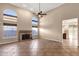 Open living area featuring a fireplace, arched windows, and a spacious layout at 1635 E Silverwood Dr, Phoenix, AZ 85048