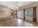 Spacious living room featuring tile flooring, french doors to the backyard, and backyard views at 1635 E Silverwood Dr, Phoenix, AZ 85048