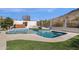 Inviting pool and hot tub offer a refreshing oasis amidst well-manicured landscaping and scenic views at 1635 E Silverwood Dr, Phoenix, AZ 85048