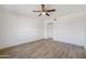 Bright bedroom featuring hardwood floors and a ceiling fan at 16657 E Gunsight Dr # 233, Fountain Hills, AZ 85268