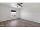 Bright bedroom featuring hardwood floors and a ceiling fan at 16657 E Gunsight Dr # 233, Fountain Hills, AZ 85268