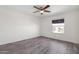 Well-lit bedroom with hardwood floors and a ceiling fan at 16657 E Gunsight Dr # 233, Fountain Hills, AZ 85268