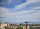 Scenic community view featuring houses, palm trees, and mountains under a partly cloudy sky at 16657 E Gunsight Dr # 233, Fountain Hills, AZ 85268