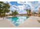 A refreshing community pool with clear water, surrounded by lounge chairs and lush desert landscaping at 16657 E Gunsight Dr # 233, Fountain Hills, AZ 85268