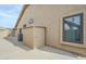 Side view of home with a beige shed, air conditioner and a view of the backyard space at 1835 E Brookwood Ct, Phoenix, AZ 85048
