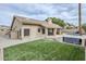 Backyard featuring a pool, artificial grass and a raised hot tub with stairs at 1835 E Brookwood Ct, Phoenix, AZ 85048