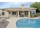 Backyard featuring a pool, a seating area, desert landscaping, and manicured bushes and shrubs at 1835 E Brookwood Ct, Phoenix, AZ 85048