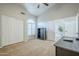 Bedroom with neutral carpet, ceiling fan, window with shutters and desk at 1835 E Brookwood Ct, Phoenix, AZ 85048