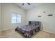 Bedroom with neutral carpet, a window with blinds, and a bed with decorative quilt and pillow at 1835 E Brookwood Ct, Phoenix, AZ 85048