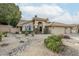 Charming single-story home features a landscaped front yard and a three-car garage at 1835 E Brookwood Ct, Phoenix, AZ 85048