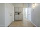 Hallway showcases built-in storage with granite countertop, contrasting neutral paint and tile flooring at 1835 E Brookwood Ct, Phoenix, AZ 85048