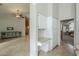 Open-concept area featuring tiled floors, built-in cabinets with granite countertop, and sightlines to the living room at 1835 E Brookwood Ct, Phoenix, AZ 85048
