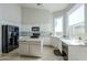 Spacious kitchen with white cabinets, granite countertops, center island, and stainless steel appliances at 1835 E Brookwood Ct, Phoenix, AZ 85048