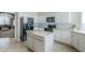 Bright kitchen features white cabinets, granite countertops, stainless steel appliances, and an island at 1835 E Brookwood Ct, Phoenix, AZ 85048