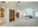 Spacious living room featuring neutral tones, large windows, and modern furniture at 1835 E Brookwood Ct, Phoenix, AZ 85048