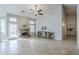 Bright living room with tile flooring, a fireplace, and access to the backyard pool at 1835 E Brookwood Ct, Phoenix, AZ 85048