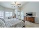 The main bedroom features neutral paint, carpet floors, ensuite bathroom access, and backyard views at 1835 E Brookwood Ct, Phoenix, AZ 85048
