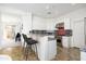 Bright kitchen featuring white cabinetry, stainless steel appliances, and granite countertops at 19475 N Grayhawk Dr # 2119, Scottsdale, AZ 85255