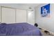 Bedroom featuring closet, blue LA Dodger banner, and a blue bedspread at 2035 S Elm St # 217, Tempe, AZ 85282