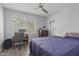 Cozy bedroom with ceiling fan, desk, and a window overlooking the outdoor scenery at 2035 S Elm St # 217, Tempe, AZ 85282