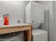 Practical laundry room with stacked washer and dryer unit and additional storage space at 2035 S Elm St # 217, Tempe, AZ 85282