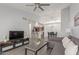 View of the open living space with the living room, dining room, and kitchen with a breakfast bar at 2035 S Elm St # 217, Tempe, AZ 85282