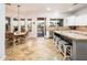 Kitchen adjacent dining area with a round table, chairs, and sliding door access to an outdoor pool and patio at 22329 N Padaro Dr, Sun City West, AZ 85375