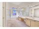 Bright bathroom featuring a large mirror, soaking tub, and separate glass shower at 22436 N 48Th St, Phoenix, AZ 85054