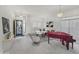 Inviting living room featuring a decorative front door and a grand piano at 22436 N 48Th St, Phoenix, AZ 85054