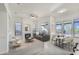 Spacious living space with a fireplace, dining area, and ample natural light at 22436 N 48Th St, Phoenix, AZ 85054