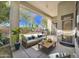 Relaxing covered patio with comfortable seating and lush backyard views at 22436 N 48Th St, Phoenix, AZ 85054