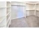 Spacious walk-in closet with shelving for organized storage at 22436 N 48Th St, Phoenix, AZ 85054