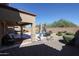 Gorgeous backyard featuring an outdoor kitchen, covered patio, lush landscaping, and a private swimming pool at 22927 N 41St St, Phoenix, AZ 85050